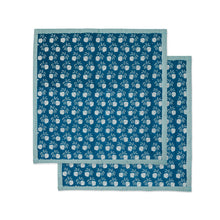 Load image into Gallery viewer, Two blue placemats with white floral patterns on a white background