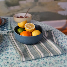 Load image into Gallery viewer, Bowl of fruits on a teal block printed patterned tablecloth