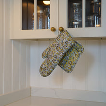 Load image into Gallery viewer, Oven mitt and pot holder hanging from loop on kitchen cabinet. 