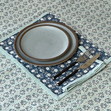 Load image into Gallery viewer, Ceramic plate with brown rim on a patterned tablecloth with cutlery.